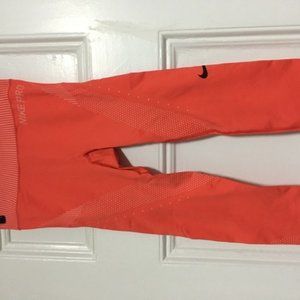 Orange Nike running tights XS